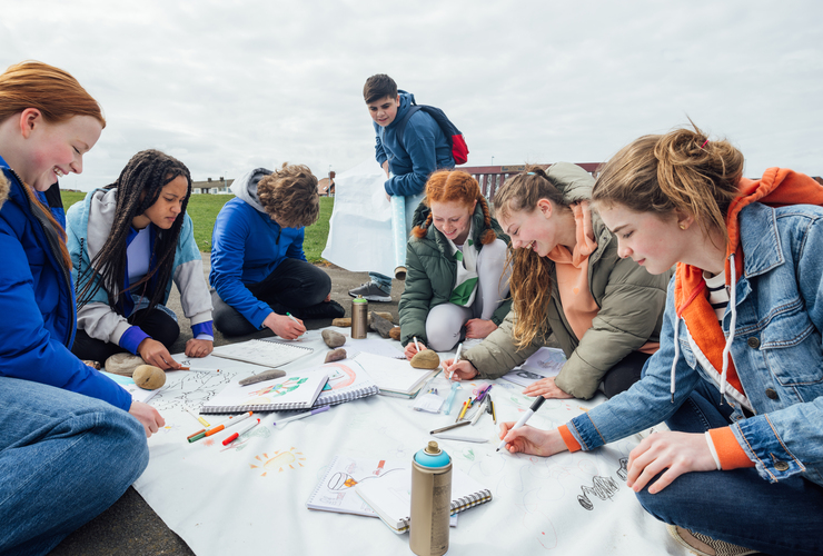 Students creating nature artwork