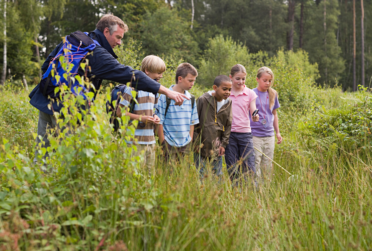 Teacher and pupils nature reserve
