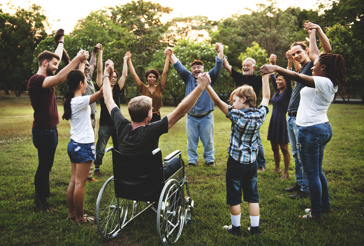 Diverse group celebrates in a park